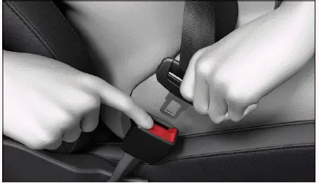 Volkswagen ID.4 pressing red release button seat belt buckle removal